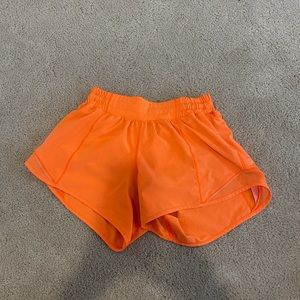 Orange Lululemon shorts! Good condition only worn a few times!
